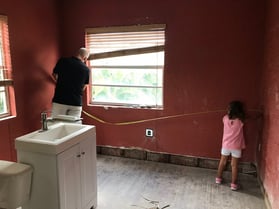 Troy Yohn and daughter Chloe working to renovate the historic Banana Inn together.